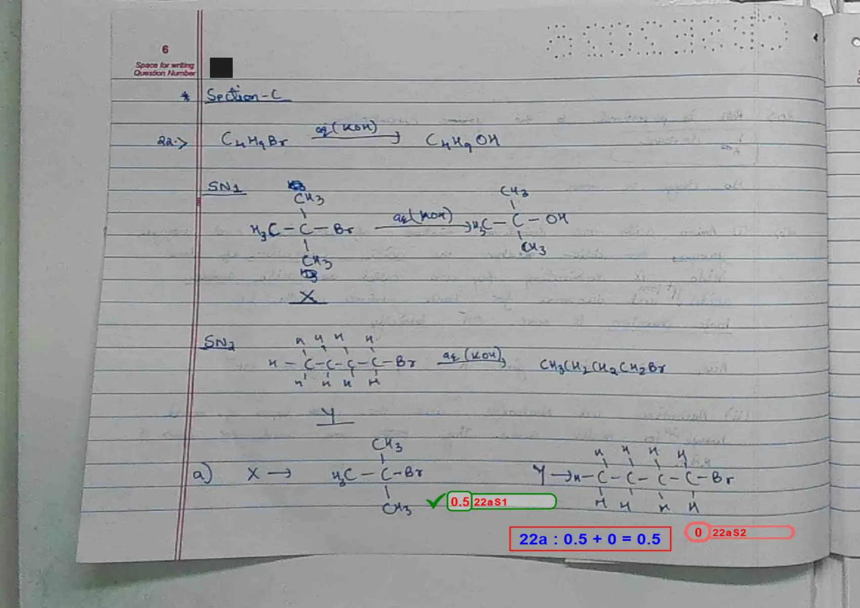 Chemistry answer script page 9, booklet page 6 — Q22 — SN1 versus SN2. "22a : 0.5 + 0 = 0.5".